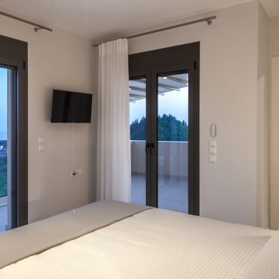 villa-andromeda-preveza-monolithi-greece-double-bedroom-with-outside-view-and-bathroom